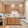 a kitchen with wooden cabinets