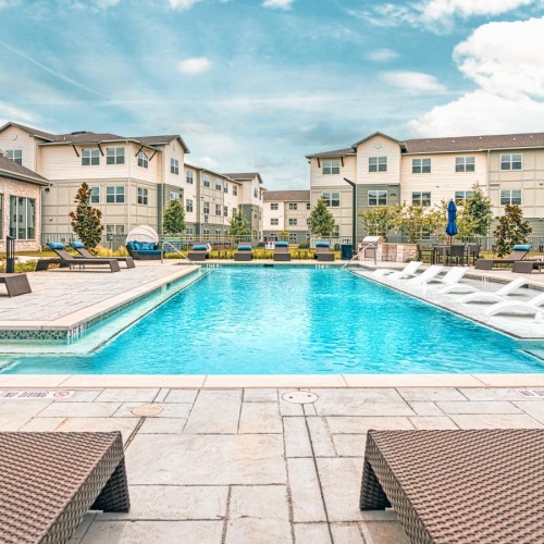 Shimmering resort-style pool a swimming pool in a courtyard