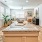 a large kitchen with an island and chairs