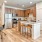 a kitchen with a bar stools